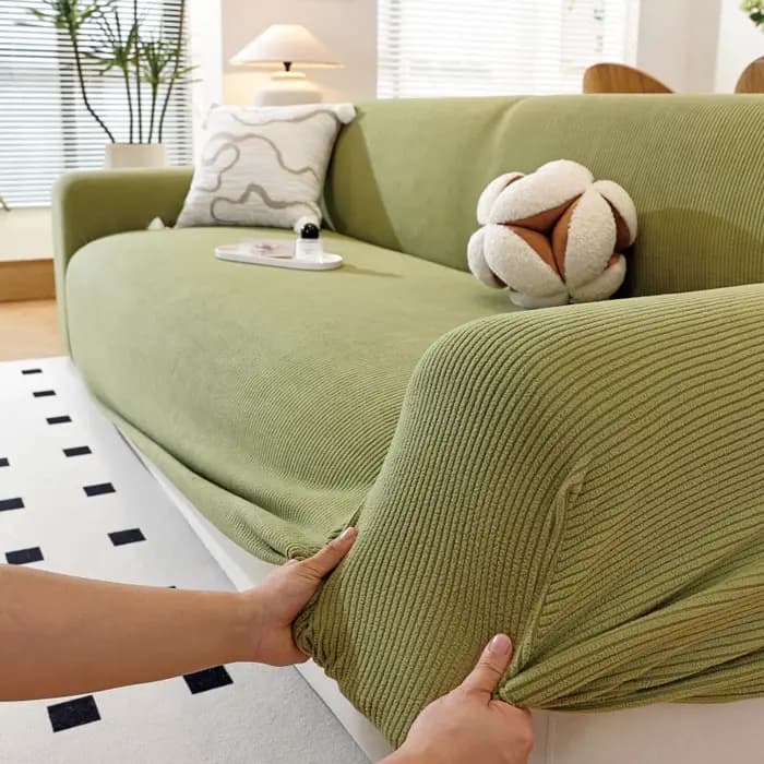Housse de canapé de couleur unie avec bande élastique