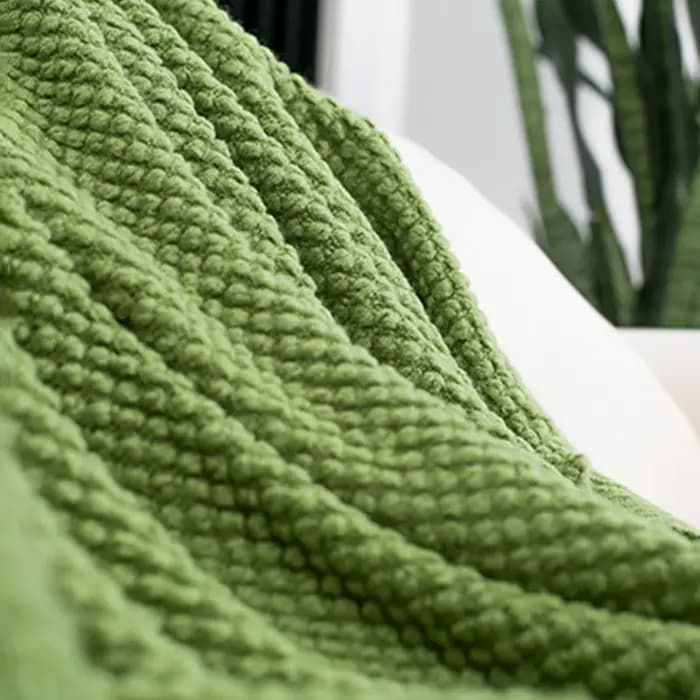 Couverture de canapé douce avec glands