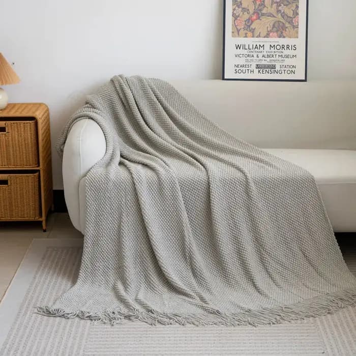 Couverture de canapé douce avec glands