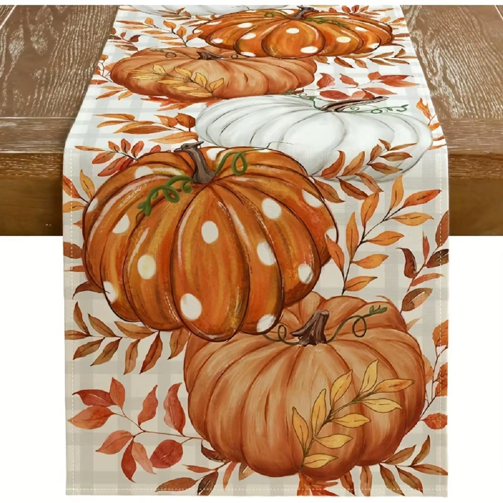 Chemin de table d'automne à pois, avec des citrouilles à pois orange et des feuilles d'automne, idéa