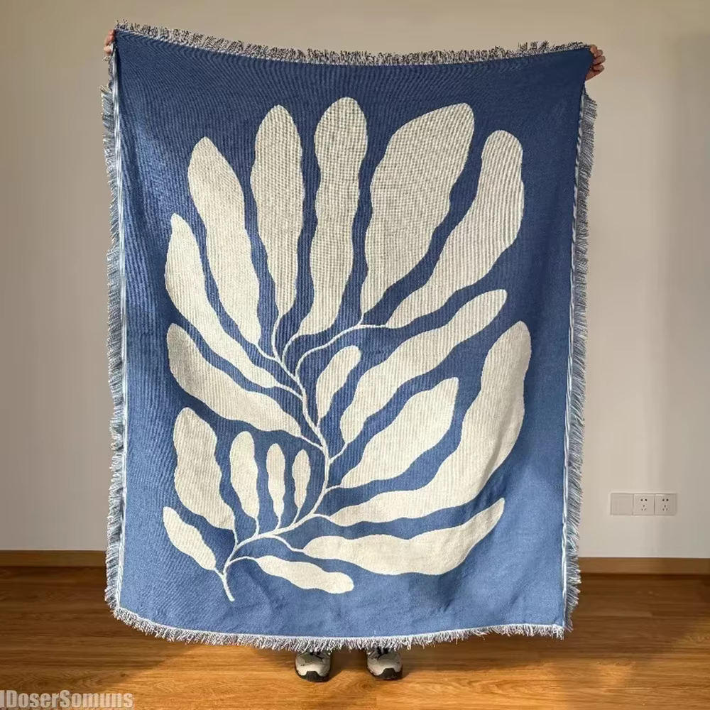 Couverture de canapé décontractée bleue avec glands